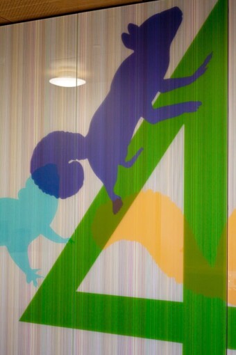 4 squirrels abstract custom glass artwork, wall-cladding in Randall Children's Hospital at Legacy Emanuel, and printed on a glass door partition by Skyline Design architectural glass manufacturer.