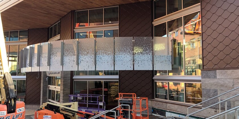 Ongoing custom glass construction on the exterior wall of Lenexa City Center Library by Skyline Design, the industry-leading architectural glass manufacturer.